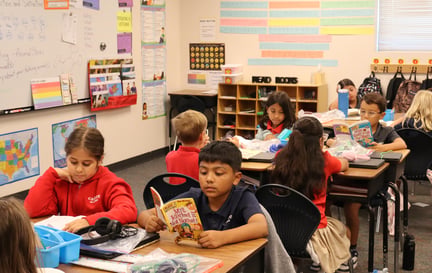 Classroom of students reading at their desks