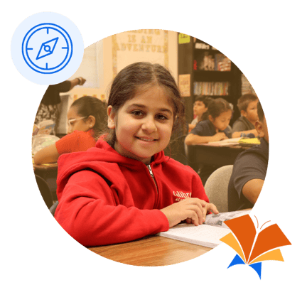 Student at her desk smiling  (1)