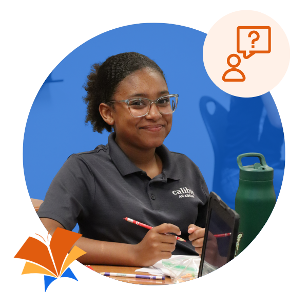 Student smiling working at her desk