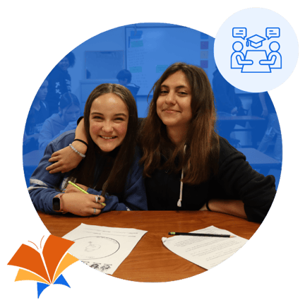 Two students sitting at desk together working