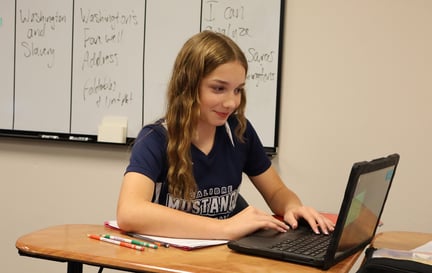 calibre student working on chromebook